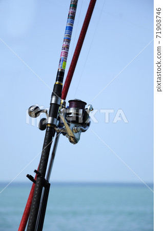 PORT DICKSON, MALAYSIA -APRIL 28, 2017: Fishing rods complete with the motor used by fisherman. These rods are used to fish in coastal fishing. PORT DICKSON, MALAYSIA -APRIL 28, 2017: Fishing rods complete with the motor used by fisherman. These rods are used to fish in coastal fishing. 71908746