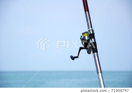 PORT DICKSON, MALAYSIA -APRIL 28, 2017: Fishing rods complete with the motor used by fisherman. These rods are used to fish in coastal fishing. PORT DICKSON, MALAYSIA -APRIL 28, 2017: Fishing rods complete with the motor used by fisherman. These rods are used to fish in coastal fishing. 71908747