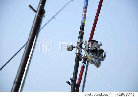 PORT DICKSON, MALAYSIA -APRIL 28, 2017: Fishing rods complete with the motor used by fisherman. These rods are used to fish in coastal fishing. 71908748