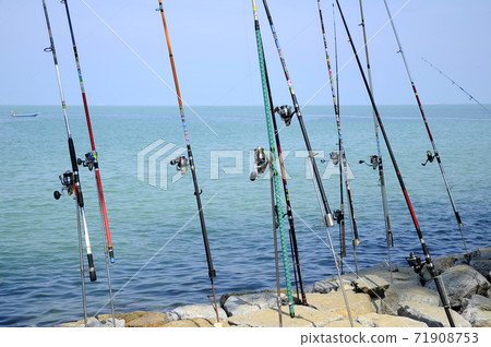 PORT DICKSON, MALAYSIA -APRIL 28, 2017: Fishing rods complete with the motor used by fisherman. These rods are used to fish in coastal fishing. 71908753