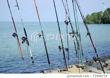 PORT DICKSON, MALAYSIA -APRIL 28, 2017: Fishing rods complete with the motor used by fisherman. These rods are used to fish in coastal fishing. 71908754