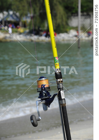 PORT DICKSON, MALAYSIA -APRIL 28, 2017: Fishing rods complete with the motor used by fisherman. These rods are used to fish in coastal fishing. PORT DICKSON, MALAYSIA -APRIL 28, 2017: Fishing rods complete with the motor used by fisherman. These rods are used to fish in coastal fishing. 71908756