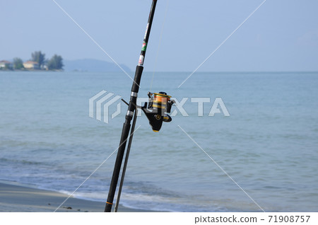 PORT DICKSON, MALAYSIA -APRIL 28, 2017: Fishing rods complete with the motor used by fisherman. These rods are used to fish in coastal fishing. PORT DICKSON, MALAYSIA -APRIL 28, 2017: Fishing rods complete with the motor used by fisherman. These rods are used to fish in coastal fishing. 71908757