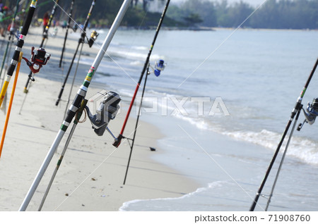 PORT DICKSON, MALAYSIA -APRIL 28, 2017: Fishing rods complete with the motor used by fisherman. These rods are used to fish in coastal fishing. PORT DICKSON, MALAYSIA -APRIL 28, 2017: Fishing rods complete with the motor used by fisherman. These rods are used to fish in coastal fishing. 71908760