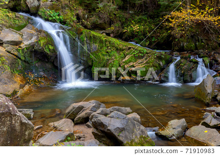 Carpathians. Skole. Waterfall on a mountain river. 71910983