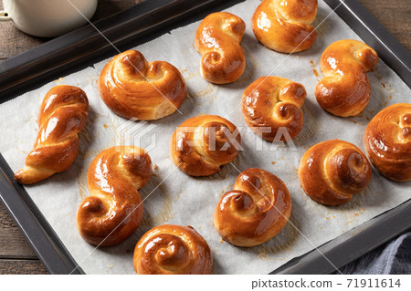 Jidasky or jidase - Czech sweet Easter pastry on a baking sheet 71911614