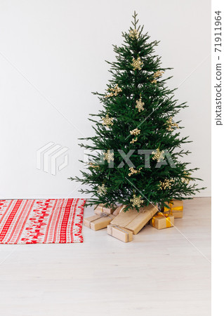 Beautiful holdiay decorated room with Christmas tree with presents under it. New year background Beautiful holdiay decorated room with Christmas tree with presents under it. New year background 71911964