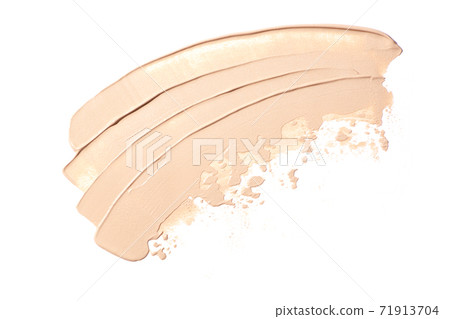 Bright beige smear of foundation in the form of a group of diagonal strokes isolated on a white background. 71913704