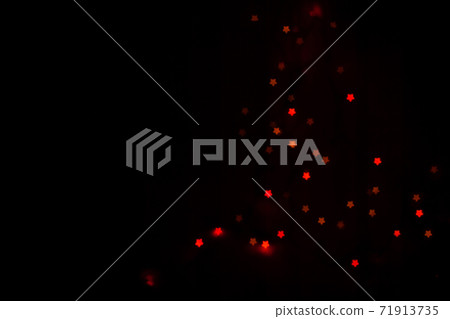 Figured boke in the form of a star on a dark background. Figured boke in the form of a star on a dark background. 71913735