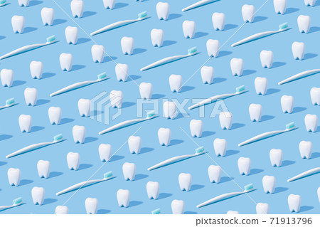White teeth pattern on a blue paper background. White teeth pattern on a blue paper background. 71913796