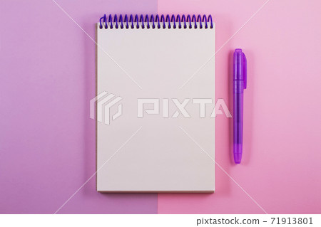 A white notepad on a double light purple background. A white notepad on a double light purple background. 71913801