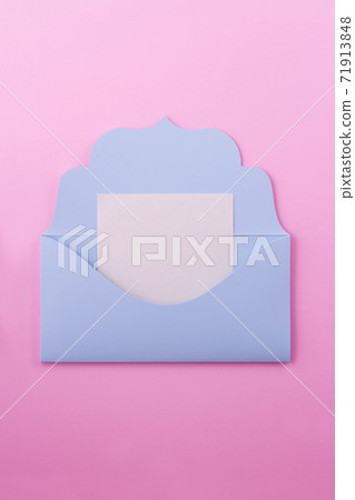 Blue envelope-letter on a pink background. 71913848