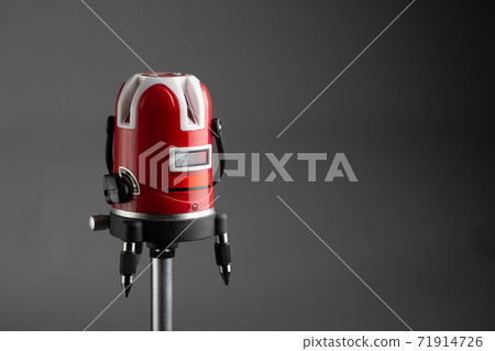 red laser level tool on grey background red laser level tool on grey background 71914726