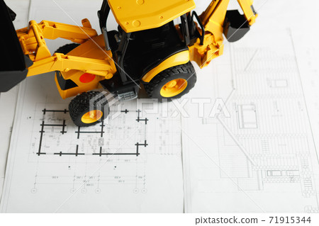 tractor toy on housing construction blueprint tractor toy on housing construction blueprint 71915344