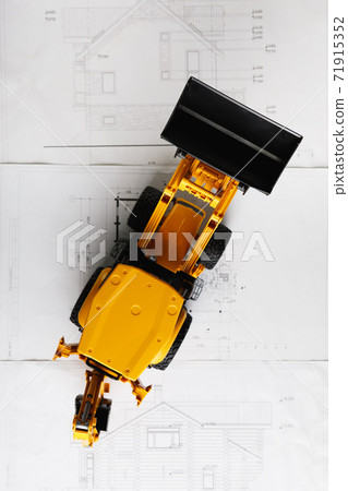 tractor toy on housing construction blueprint tractor toy on housing construction blueprint 71915352