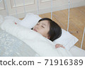 Girl sleeping 71916389