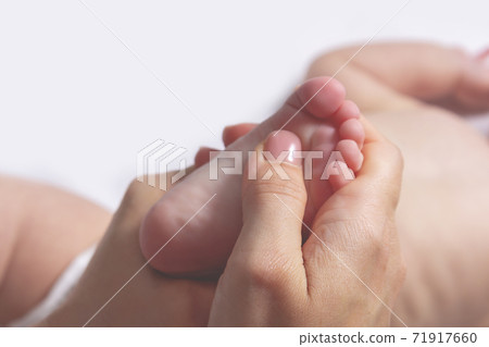 Baby massage. Gymnastics for small kids. Close up. Baby massage. Gymnastics for small kids. Close up. 71917660