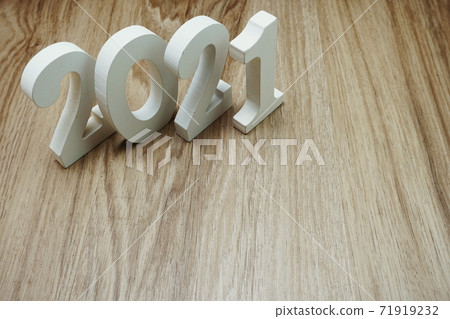 2021 Happy New Year with space copy on wooden background 2021 Happy New Year with space copy on wooden background 71919232