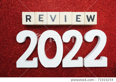 review 2022 word alphabet letters on red glitter background 71919254