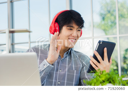 The man digital tablet while greeting by video chat conferences The man digital tablet while greeting by video chat conferences 71920060