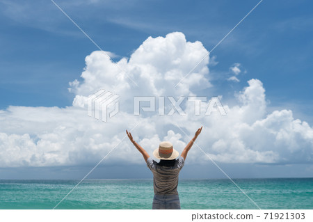 Woman travel around the world with summer beach freedom and relax life. 71921303