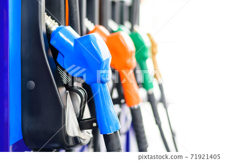 Colorful Petrol pump filling nozzles isolated on white background , Gas station in a service Colorful Petrol pump filling nozzles isolated on white background , Gas station in a service 71921405