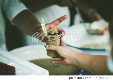 Feeding to the poor to hands of a beggar Feeding to the poor to hands of a beggar 71921872