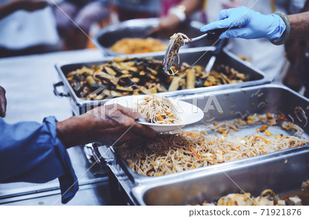 Feeding to the poor to hands of a beggar Feeding to the poor to hands of a beggar 71921876