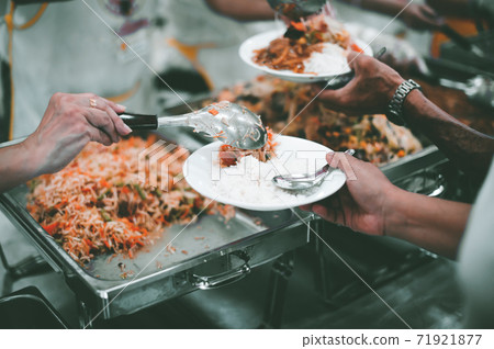 Feeding to the poor to hands of a beggar Feeding to the poor to hands of a beggar 71921877