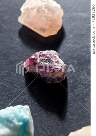 quartz crystals and gem stones on slate background quartz crystals and gem stones on slate background 71922260