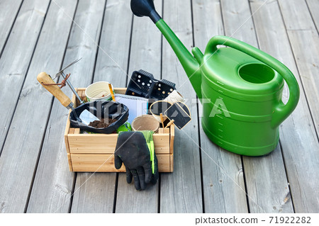 box with garden tools and watering can in summer box with garden tools and watering can in summer 71922282