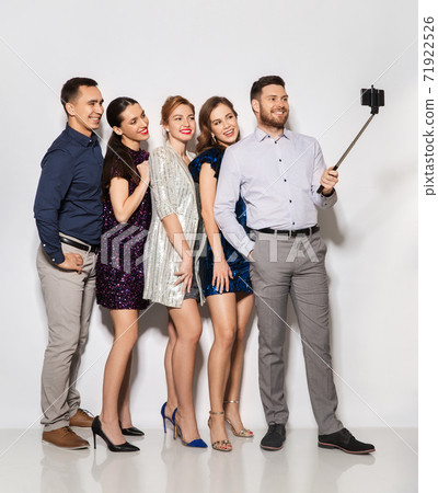 happy friends taking selfie by smartphone at party 71922526