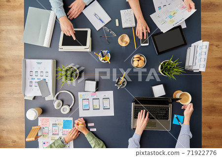 business team with gadgets working at office table business team with gadgets working at office table 71922776