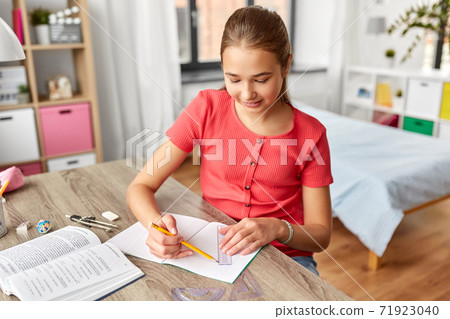 student girl with ruler drawing line in notebook student girl with ruler drawing line in notebook 71923040