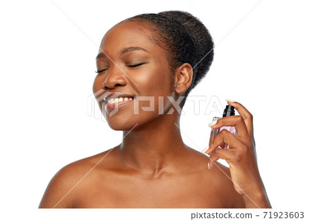 young african american woman with perfume young african american woman with perfume 71923603