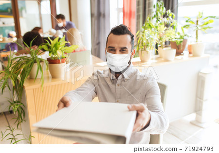 creative male office worker in mask with folder creative male office worker in mask with folder 71924793