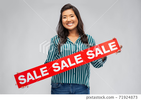 happy smiling young asian woman with sale banner 71924873