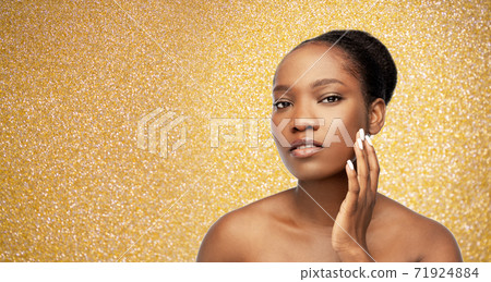 portrait of african woman touching her face 71924884