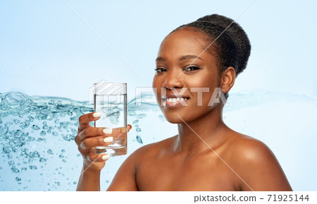 young african american woman with glass of water young african american woman with glass of water 71925144