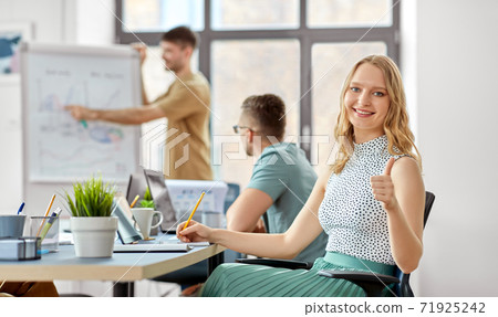 smiling businesswoman at office conference smiling businesswoman at office conference 71925242