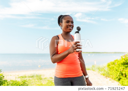 african american woman drinking water after sports african american woman drinking water after sports 71925247