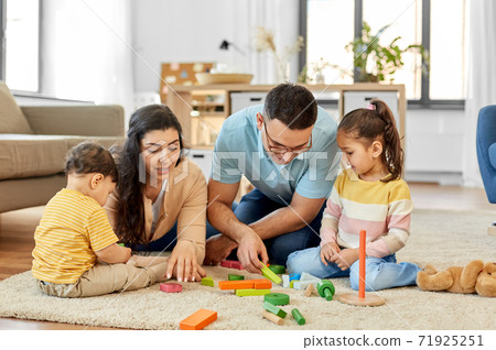 happy family palying with wooden toys at home happy family palying with wooden toys at home 71925251