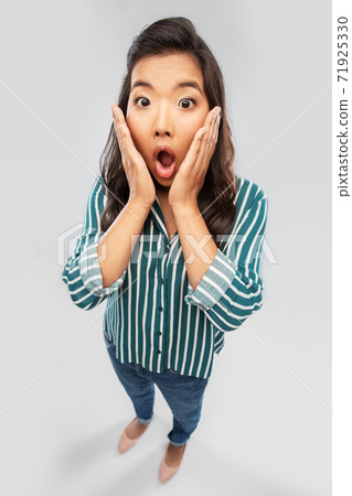 shocked asian woman with open mouth goggling 71925330