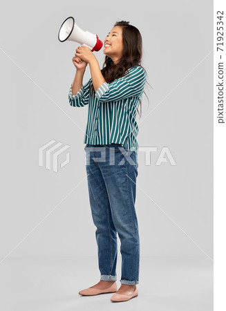 happy smiling asian woman speaking to megaphone happy smiling asian woman speaking to megaphone 71925342
