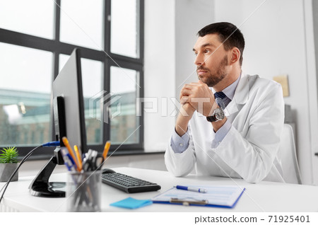 male doctor with computer working at hospital male doctor with computer working at hospital 71925401