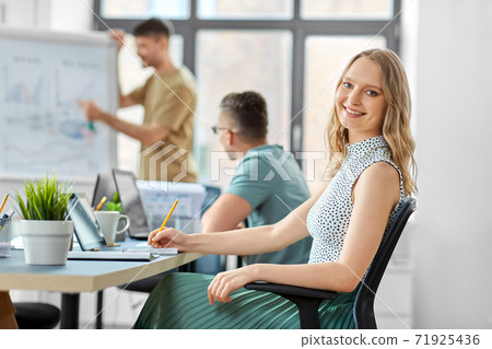 smiling businesswoman at office conference smiling businesswoman at office conference 71925436