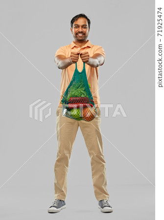 happy indian man with food in reusable net tote happy indian man with food in reusable net tote 71925474