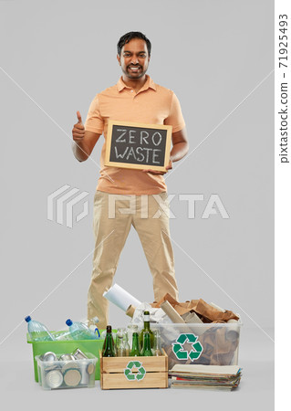 smiling man sorting paper, glass and plastic waste smiling man sorting paper, glass and plastic waste 71925493