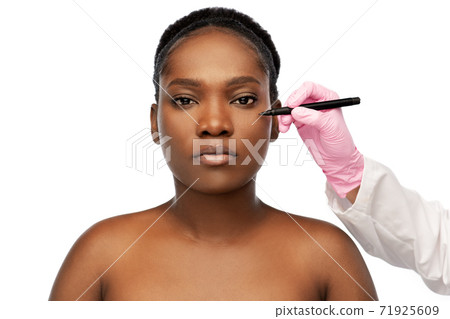 face of african woman and hand with marker 71925609