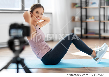woman or sports blogger streaming online at home woman or sports blogger streaming online at home 71925650